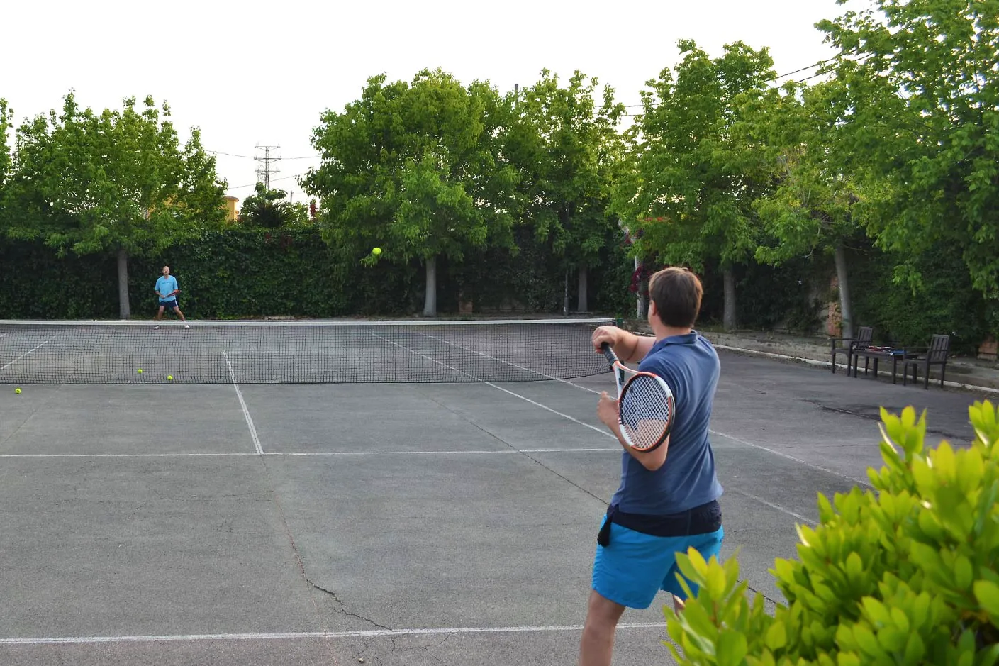 Two men playing tennis